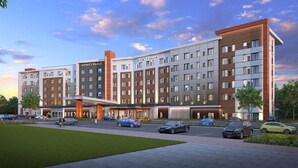 A multi-story hotel with a modern design, featuring a central atrium and multiple entry points. - Hyatt House Indianapolis / Fishers (Fishers)