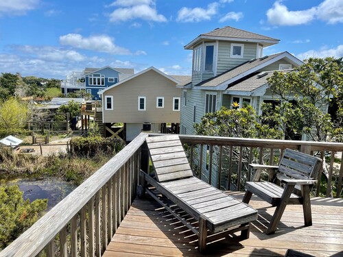 Xenia House:  Enjoy decks and screened porch overlooking the marsh.