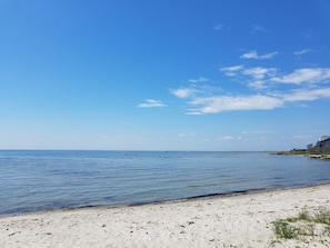 A beach with clear skies and calm waters.