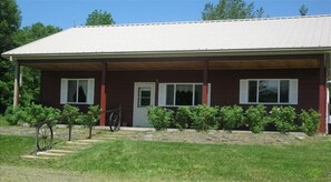 Stroll up to the charming entrance, where a welcoming porch and beautifully manicured lawn await.