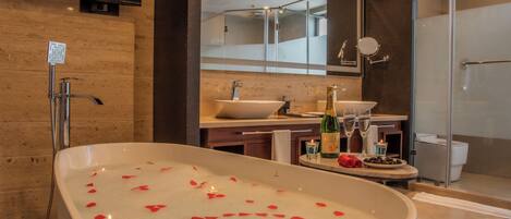 Designer toiletries, hair dryer, bathrobes, slippers