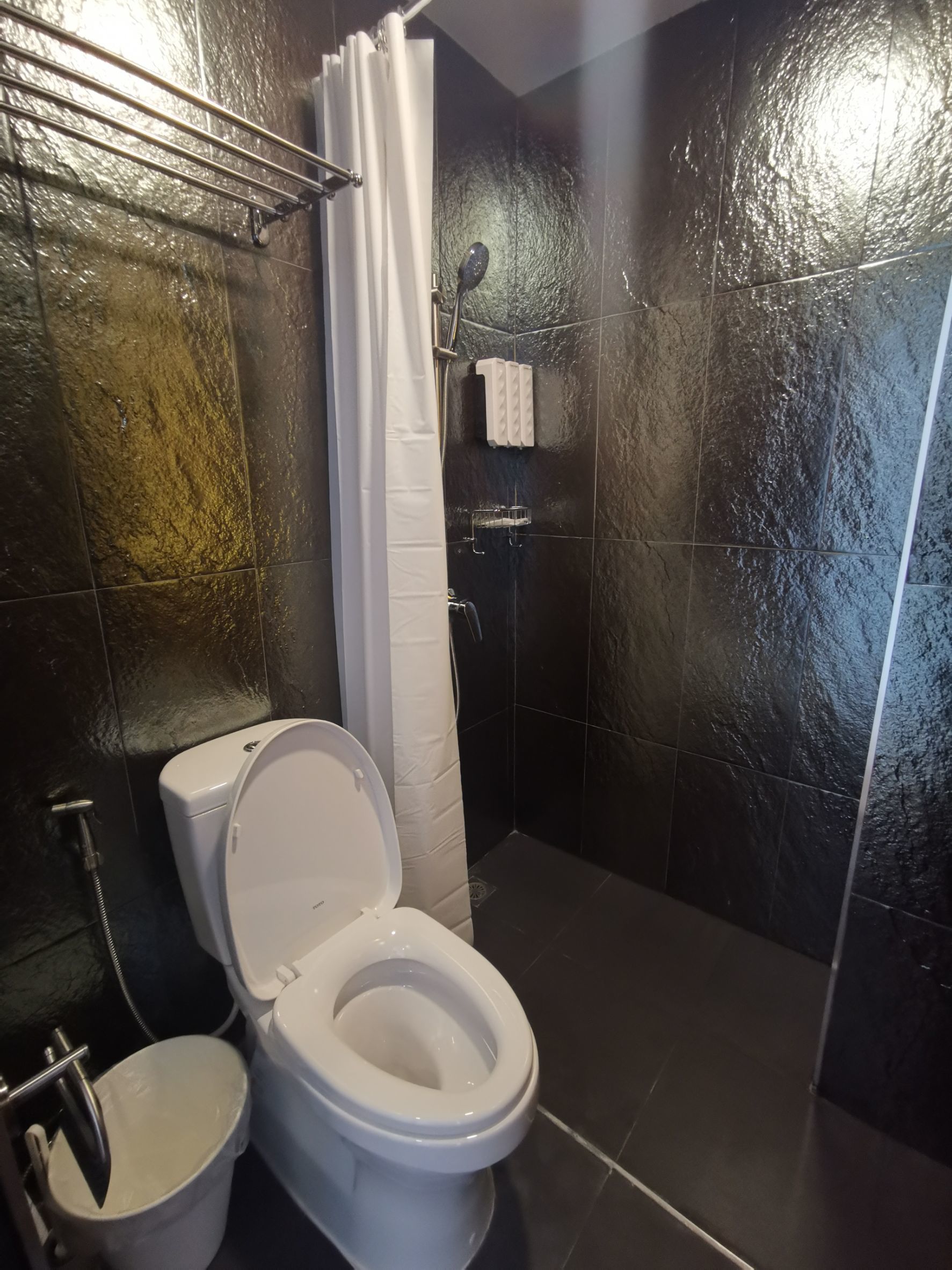 deluxe triple room | bathroom | shower, hair dryer, bathrobes, slippers