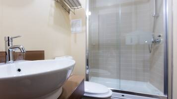 Shower, hair dryer, slippers, towels