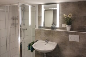 Traditional Condo | Bathroom | Shower, hair dryer, towels, soap