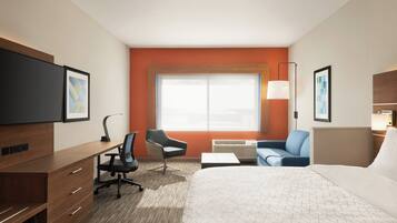 A hotel room with a bed, desk, chair, sofa, and a large window.