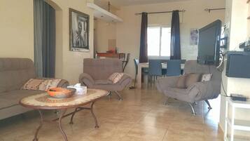 Family Villa, 3 Bedrooms, Pool View, Poolside | Living room | Flat-screen TV