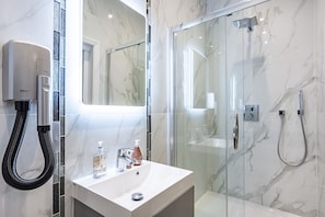 Shower, hair dryer, towels