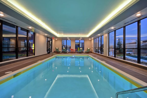 Indoor pool, open 8:00 AM to 10:00 PM, pool loungers