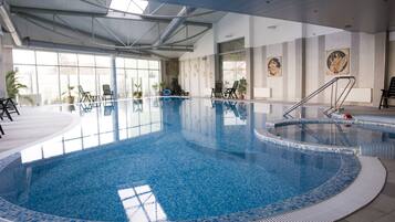 Indoor pool, open 9:00 AM to 8:00 PM, pool umbrellas, pool loungers