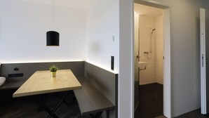 A modern bathroom with a shower and a toilet.