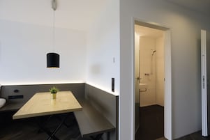 Premium bedding, desk, laptop workspace, soundproofing