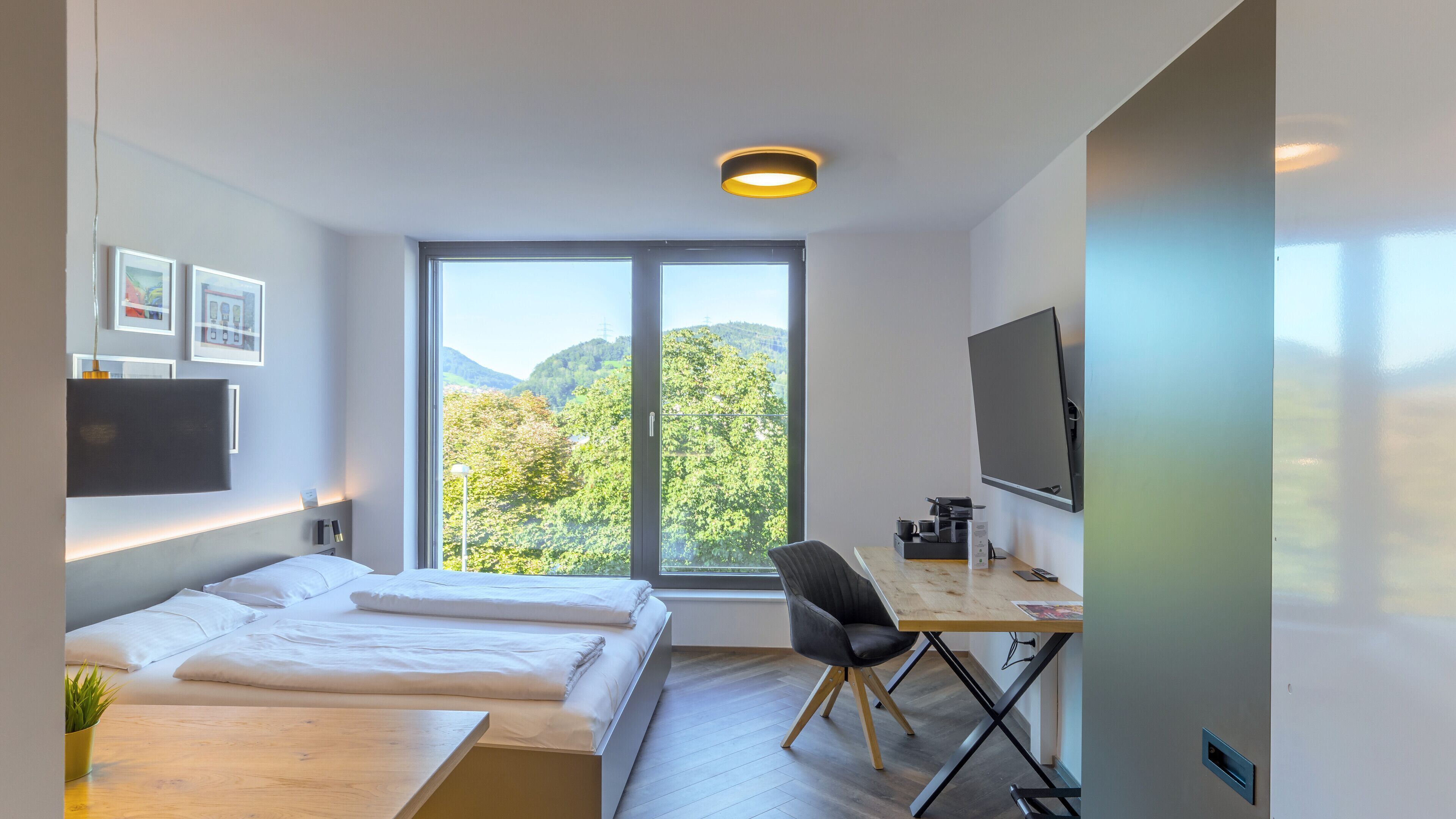 Premium bedding, individually furnished, desk, laptop workspace