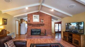 60-inch flat-screen TV with cable channels, TV, fireplace