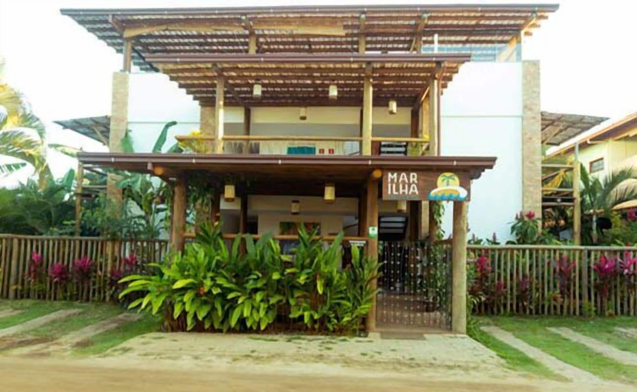 A two-story building with a sign reading "MAR ILAH".