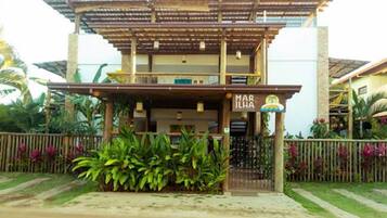 A two-story building with a sign reading "MAR ILAH".