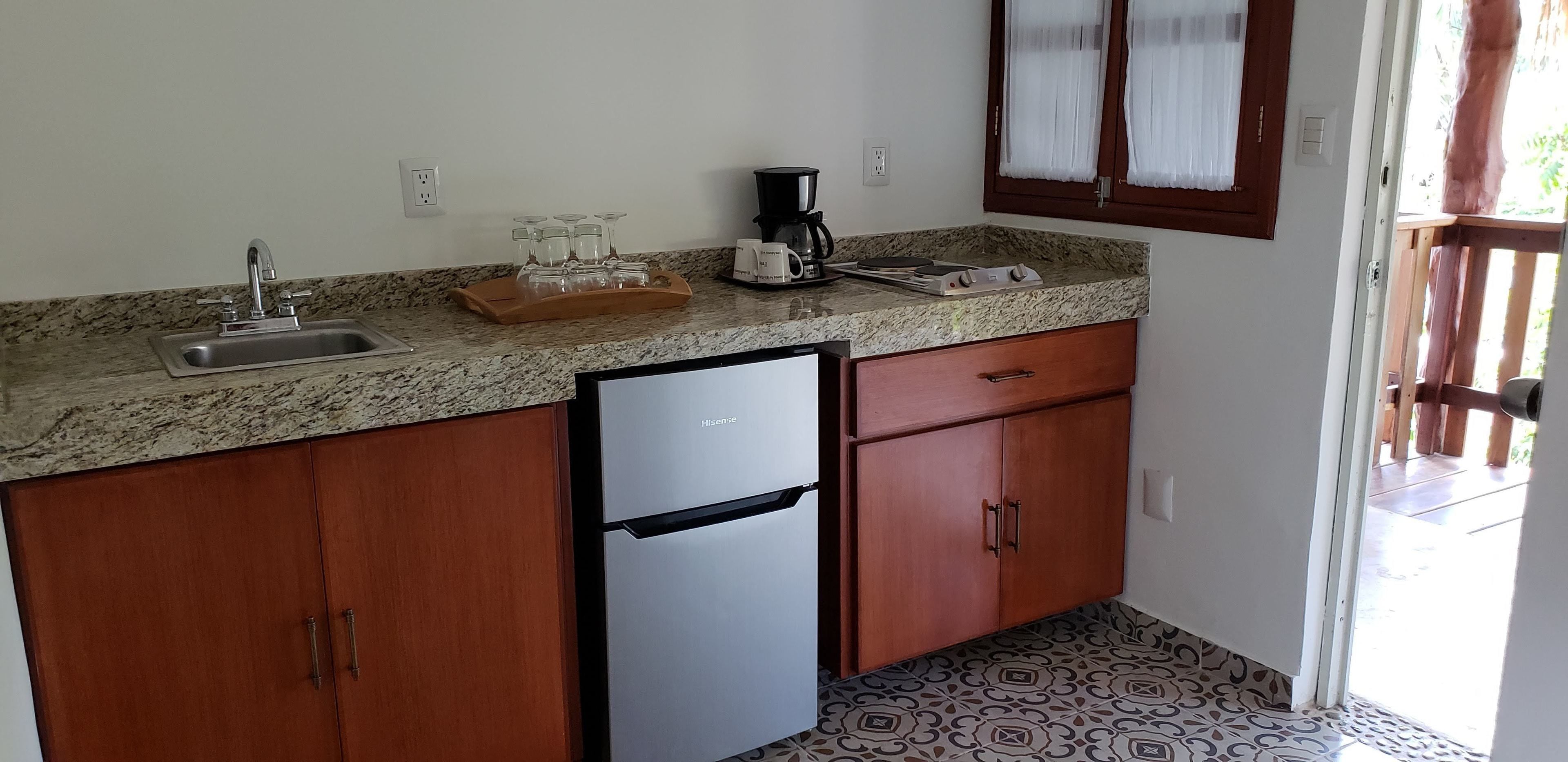 superior room, 1 queen bed, balcony | private kitchenette | coffee/tea maker