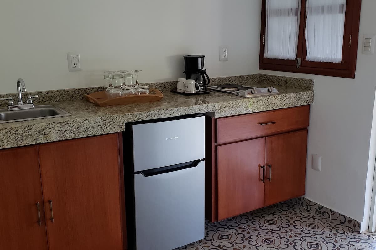 superior room, 1 queen bed, balcony | private kitchenette | coffee/tea maker