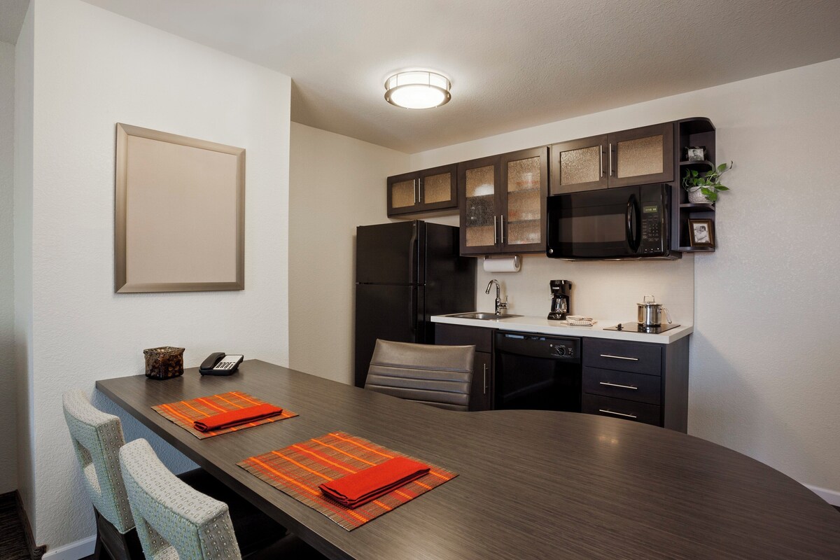 Premium bedding, desk, laptop workspace, iron/ironing board