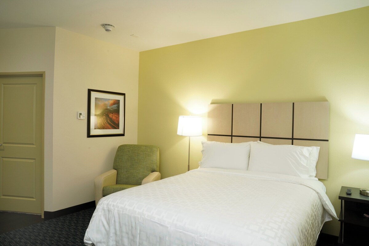 Premium bedding, desk, laptop workspace, iron/ironing board