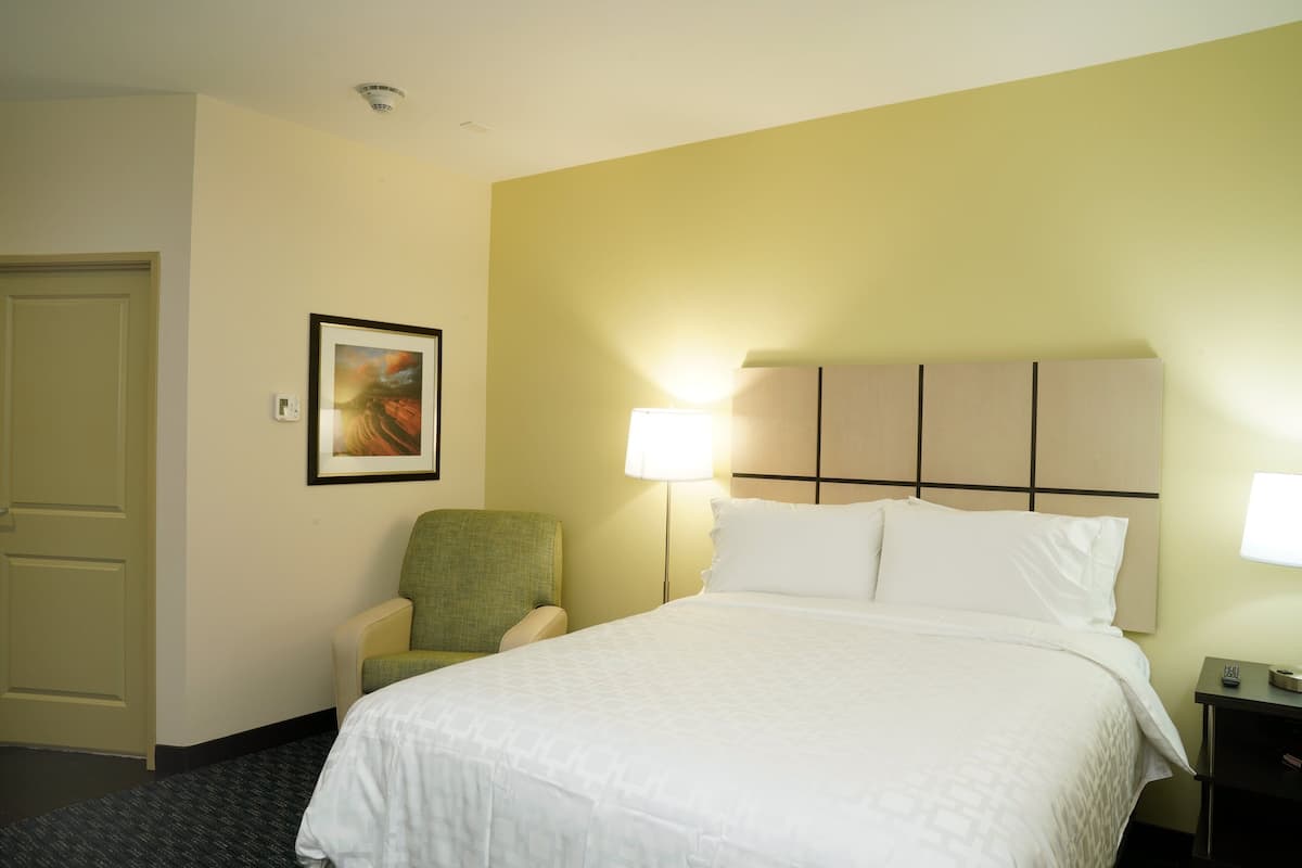 Premium bedding, desk, laptop workspace, iron/ironing board