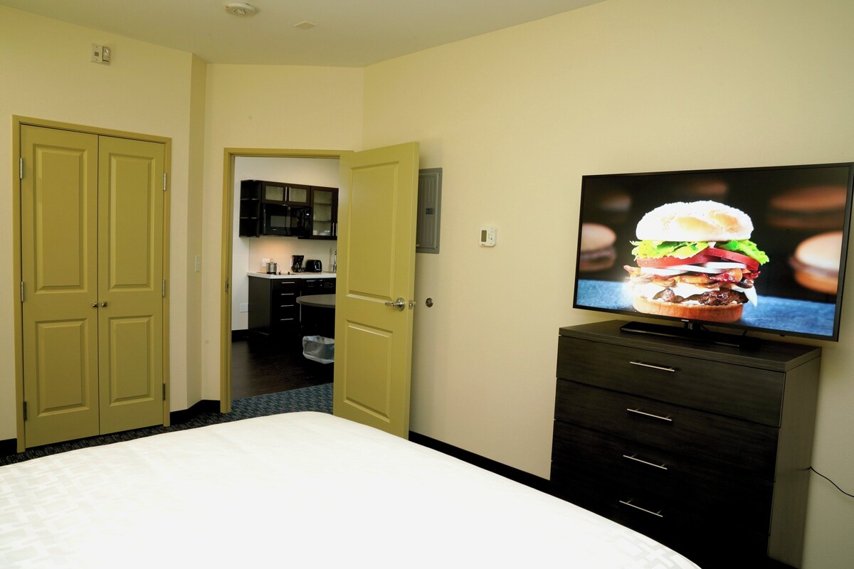 Premium bedding, desk, laptop workspace, iron/ironing board