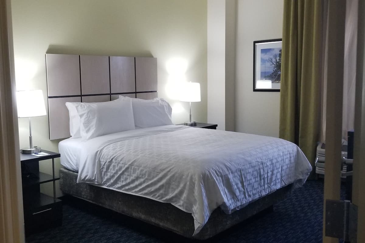 Premium bedding, desk, laptop workspace, iron/ironing board