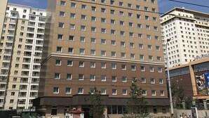 A multi-story hotel with a prominent sign at the top. - Toyoko Inn Ulaanbaatar (Ulaanbaatar)