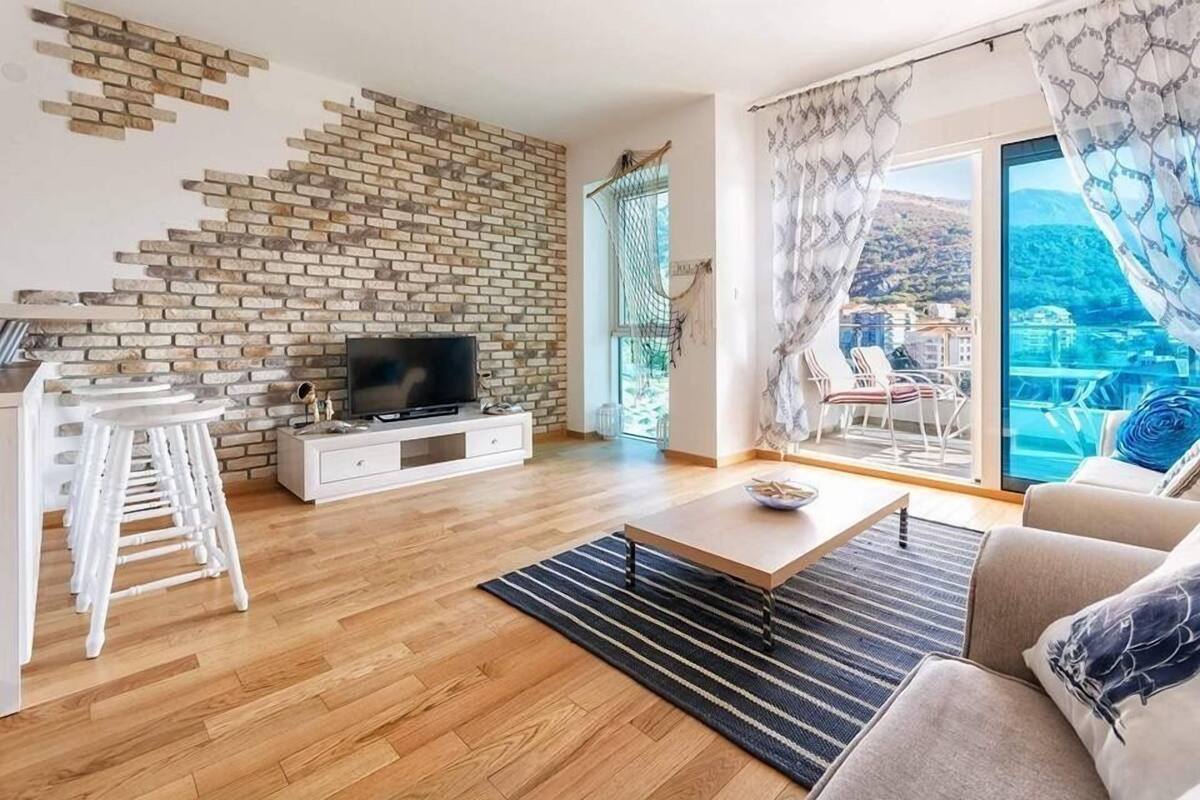 Apartment, 2 Bedrooms (Sea) | Living area | Flat-screen TV