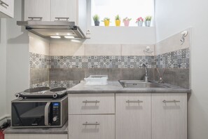 Appartement | Cuisine privée | Réfrigérateur, micro-ondes, plaque de cuisson, machine à expresso