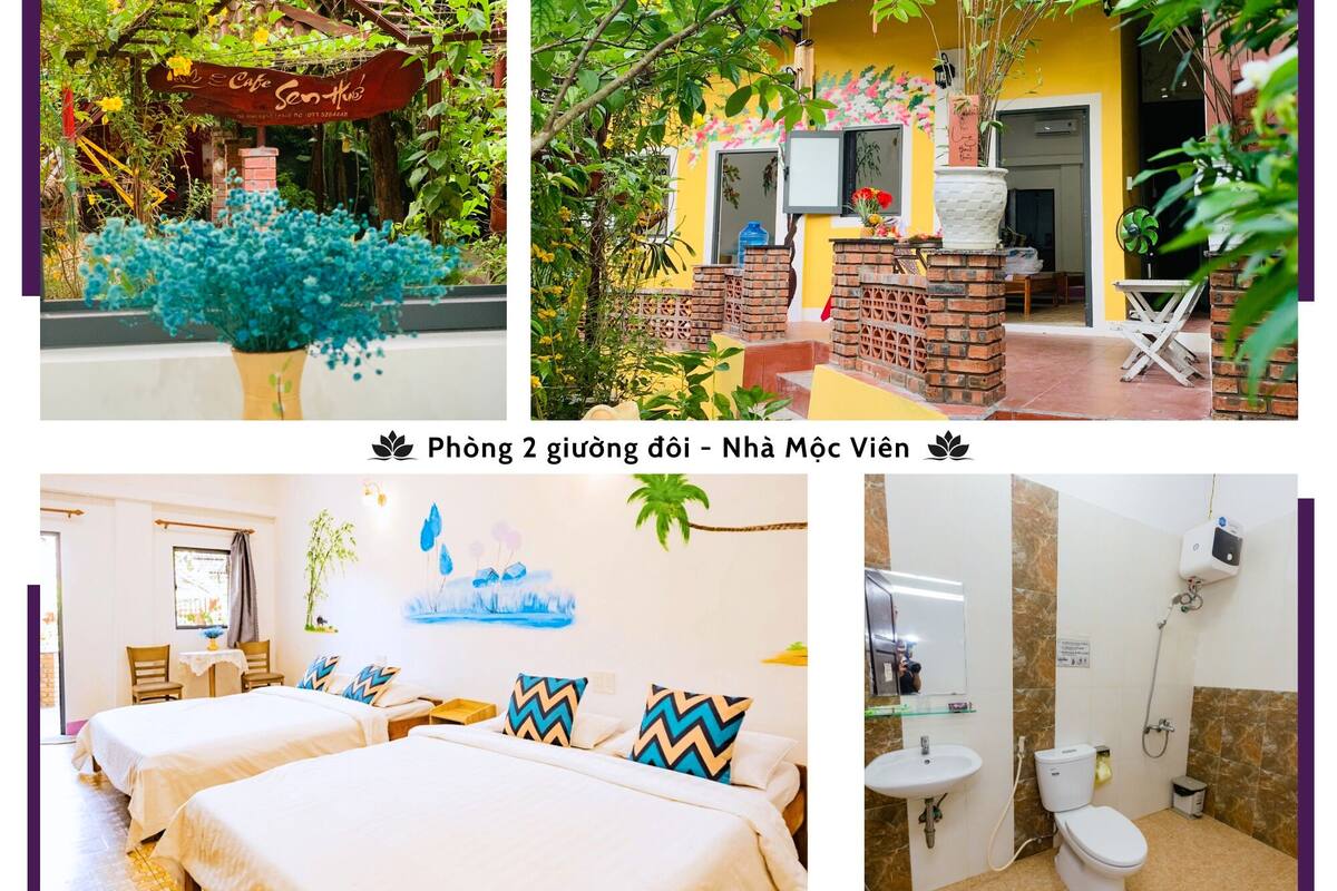 A hotel with a garden entrance, a courtyard with a brick structure, a room with two beds and a bathroom with a toilet and sink.