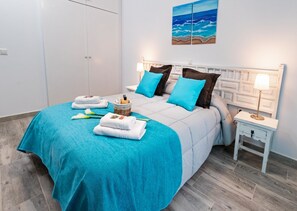 Apartment, 2 Bedrooms, Terrace, Partial Sea View | 2 bedrooms, individually decorated, desk, laptop workspace