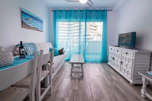 Apartment, 2 Bedrooms, Terrace, Partial Sea View | Living room | Flat-screen TV