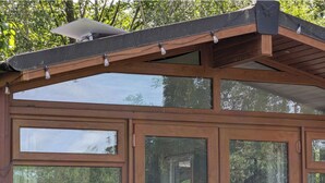 A wooden structure with multiple windows and a sloped roof. - Felmoor Park Northumberland Lodge With Hot Tub - 4 (Morpeth)