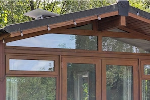 A wooden structure with multiple windows and a sloped roof. - Felmoor Park Northumberland Lodge With Hot Tub - 4 (Morpeth)