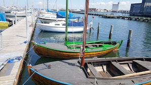 A marina with several boats docked at wooden piers. - Struer Town Apartment (Struer)