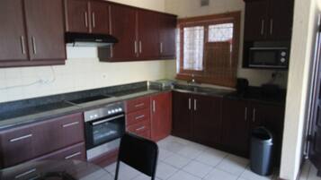 Apartment | Private kitchen | Fridge, microwave, oven, stovetop