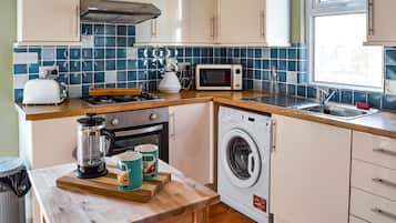 Two-Bedroom Apartment | Private kitchen | Full-size fridge, microwave, oven, stovetop