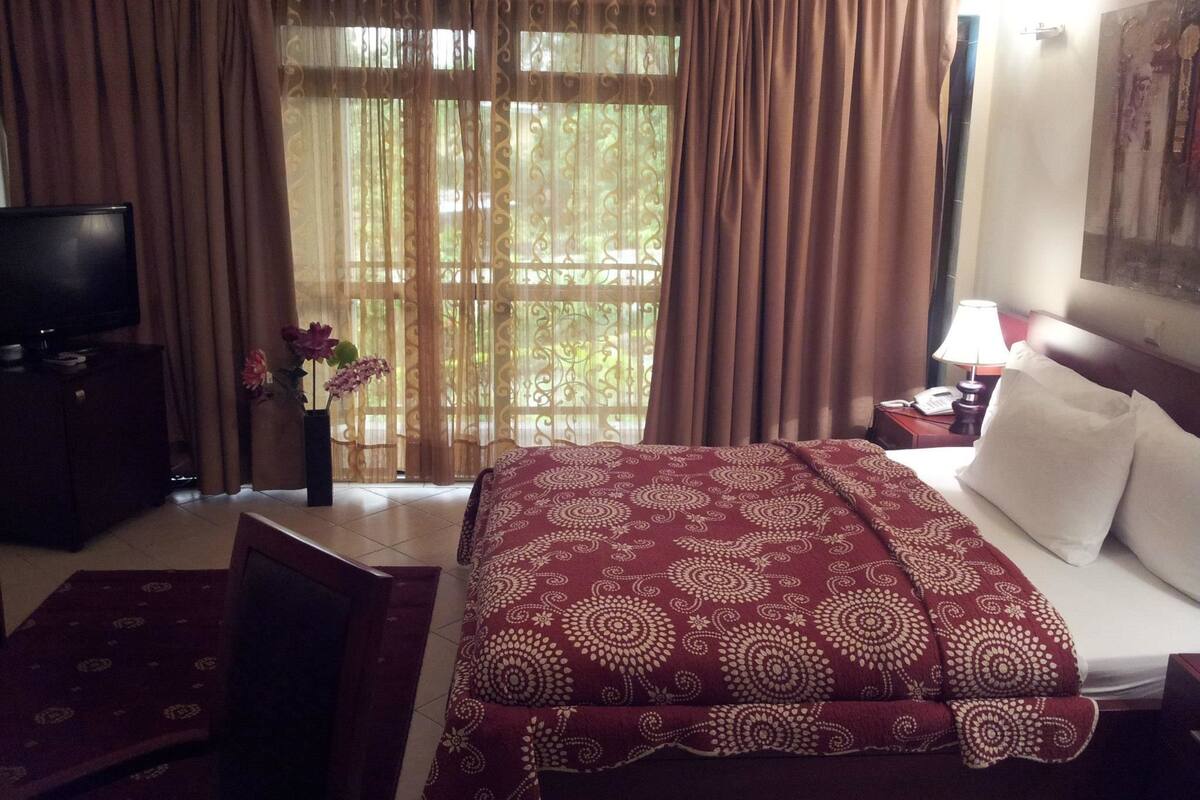 minibar, desk, blackout curtains, iron/ironing board