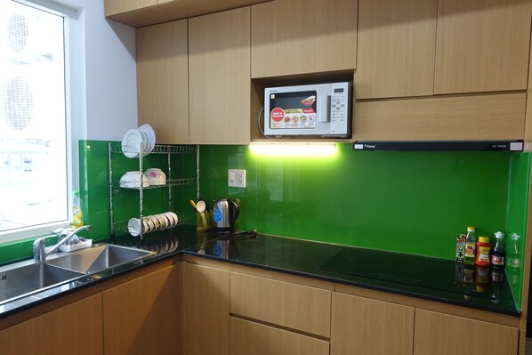 Fridge, microwave, cookware/dishes/utensils
