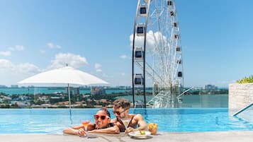 Outdoor pool, open 7:00 AM to 11:00 PM, sun loungers