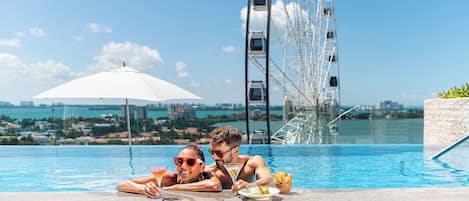 Outdoor pool, open 7:00 AM to 11:00 PM, sun loungers