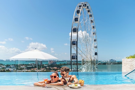Outdoor pool, open 7:00 AM to 11:00 PM, sun loungers