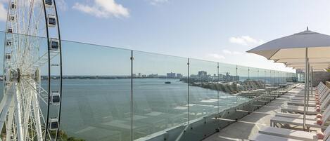 Outdoor pool, open 7:00 AM to 11:00 PM, pool loungers