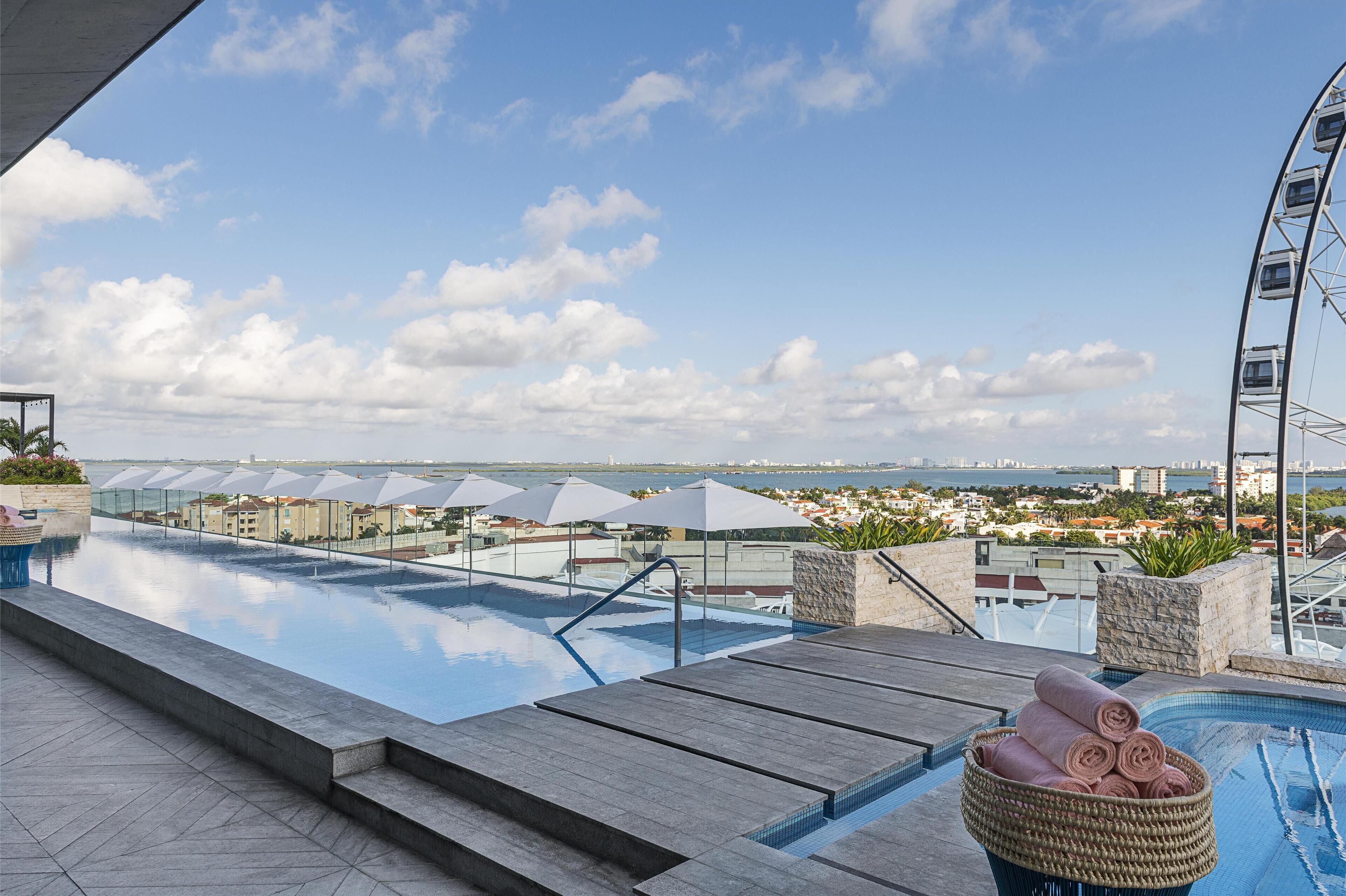 outdoor pool, open 7:00 am to 11:00 pm, pool loungers