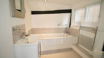 Luxury Double Room, 1 King Bed | Bathroom | Combined shower/bathtub, deep-soaking bathtub, designer toiletries