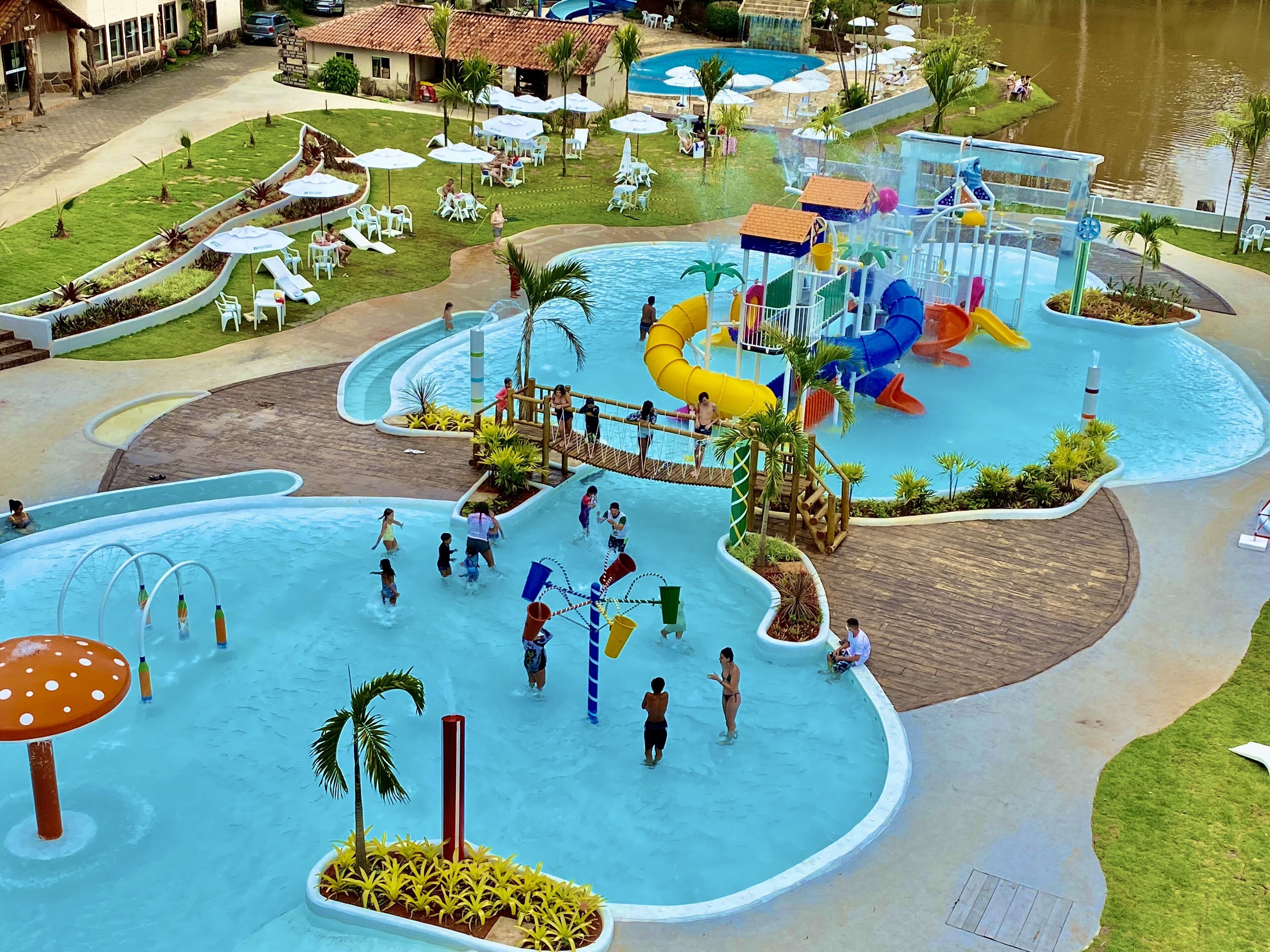 A water park with multiple pools, slides, and play structures.
