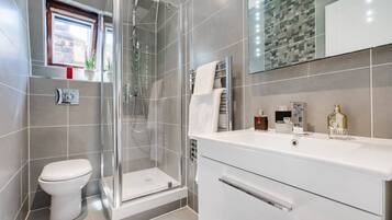 Shower, hair dryer, towels