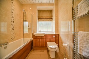 Combined shower/bathtub, towels, soap
