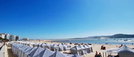 On the beach, sun-loungers