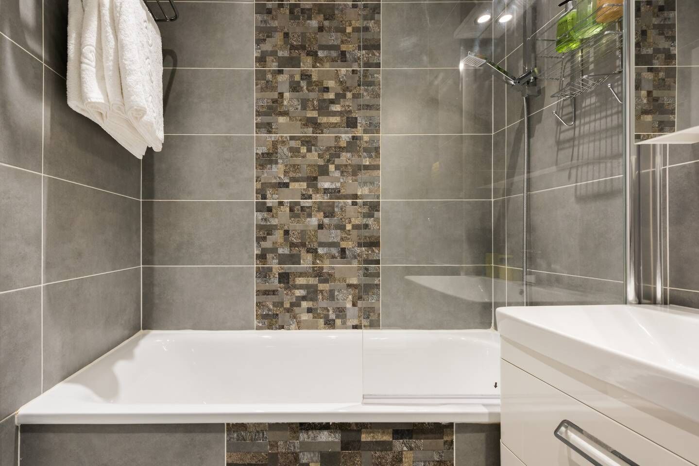 Bathtub, hair dryer, towels, soap
